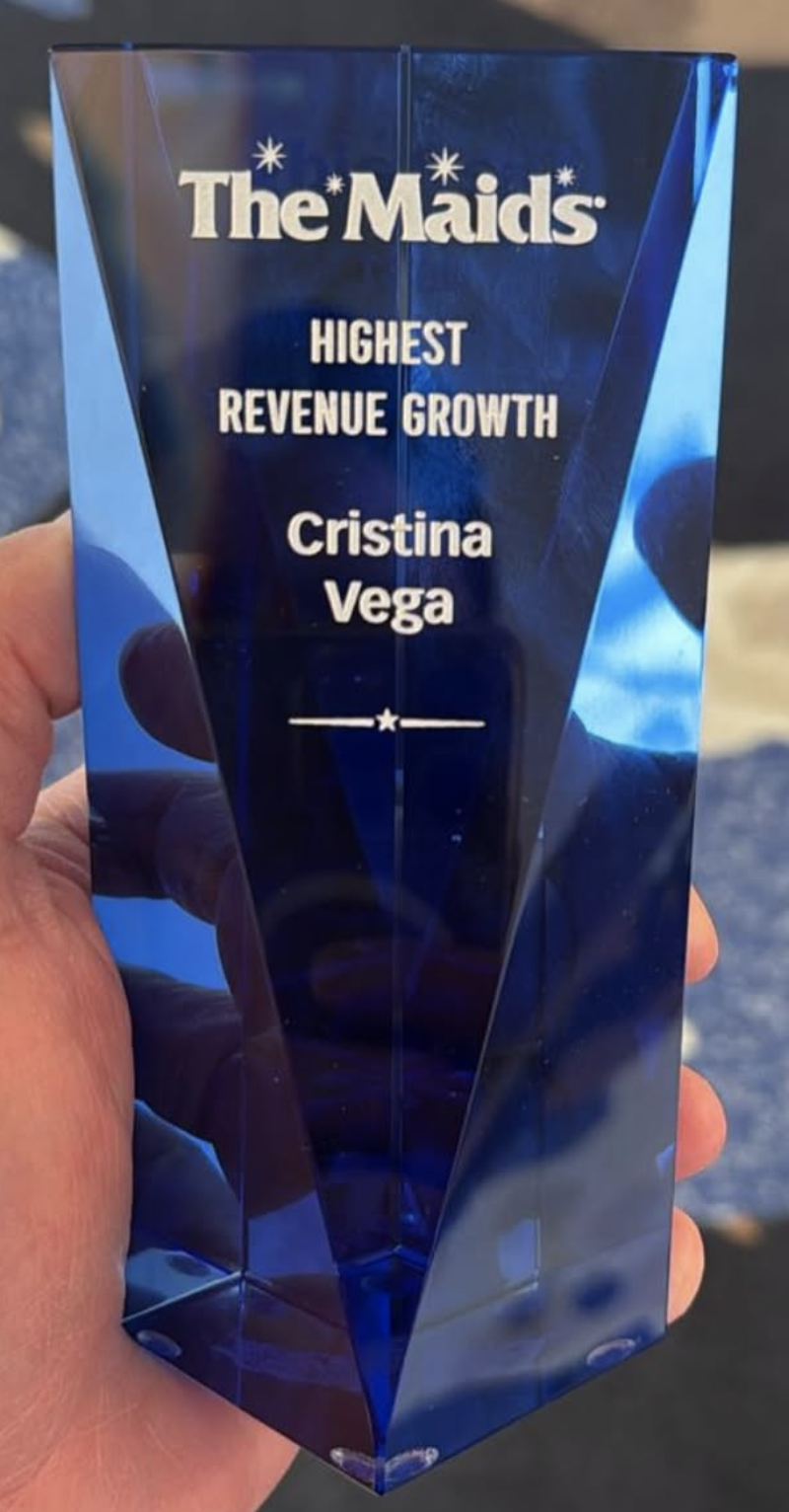 The Maids 'Highest Revenue Growth' crystal award engraved with Cristina Vega's name